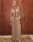 Alemais Sustainable Stefanie Knit Shirt Dress. Patterned Dress in a lifestyle image.