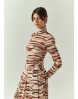 Exquise Cheyenne Blouse pair with Elina Skirt.