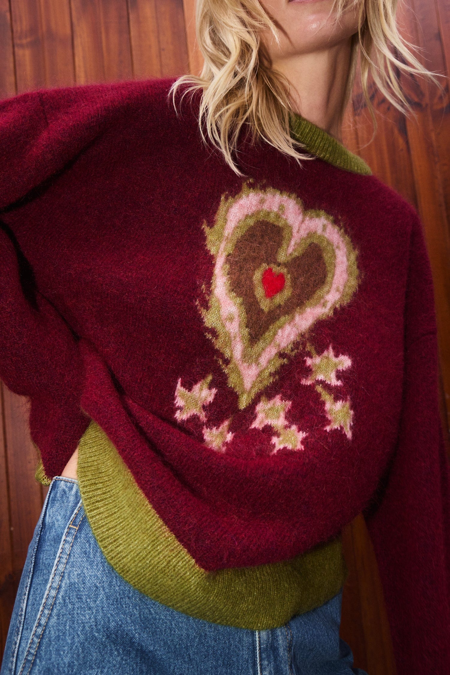 Person wearing a Alemais Fredo Sweater. Sustainable Top. Knitwear. Heart design.