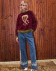 Alemais Fredo Sweater. Sustainable Top. Knitwear. Lifestyle Image