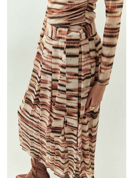 Long-sleeve dress with a pattern on a light background